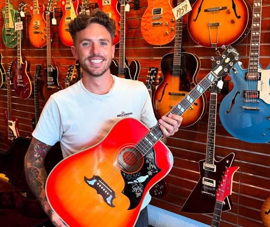 Sam Hastings and a 1960 Gibson Custom Dove Limited Edition at Redwoods Vintage Guitars St Pete Florida